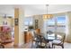Bright dining area with a round glass table and water views at 5200 Brittany S Dr # 602, St Petersburg, FL 33715