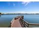 Long wooden dock extending over calm water at 5200 Brittany S Dr # 602, St Petersburg, FL 33715