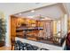 Modern kitchen features wood cabinets, granite counters, and stainless steel appliances at 5200 Brittany S Dr # 602, St Petersburg, FL 33715