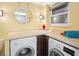 Convenient laundry room with front load washer and dryer at 5200 Brittany S Dr # 602, St Petersburg, FL 33715