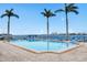 Inviting community pool with waterfront views and lounge chairs at 5200 Brittany S Dr # 602, St Petersburg, FL 33715