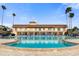 Large community pool with surrounding lounge chairs at 5200 Brittany S Dr # 602, St Petersburg, FL 33715