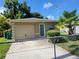 Cozy single-Gathering home with a well-kept lawn, a driveway, and chain-link fence at 707 13Th W St, Palmetto, FL 34221