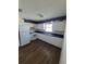 Kitchen with white cabinets, blue countertops and appliances at 707 13Th W St, Palmetto, FL 34221