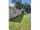 Fenced backyard with green grass at 707 13Th W St, Palmetto, FL 34221