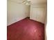 Bedroom with double door closet and dark purple carpet at 707 13Th W St, Palmetto, FL 34221