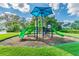 playground with shaded play structure and slides at 10417 Crooked Creek Ct, Parrish, FL 34219