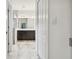 Elegant bathroom with double vanity, marble tile, and large mirror at 10417 Crooked Creek Ct, Parrish, FL 34219