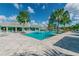 Resort-style pool with expansive sundeck and shaded seating areas at 10417 Crooked Creek Ct, Parrish, FL 34219