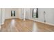 Bright and airy living room with light wood flooring and neutral walls at 10417 Crooked Creek Ct, Parrish, FL 34219