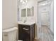 Small bathroom with single vanity and access to hallway at 10417 Crooked Creek Ct, Parrish, FL 34219