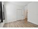 Bright bedroom with neutral walls and wood-look flooring at 10417 Crooked Creek Ct, Parrish, FL 34219