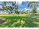 Fenced dog park with grassy area for pets to play at 10417 Crooked Creek Ct, Parrish, FL 34219