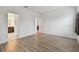 Bright bedroom with wood-look flooring and en-suite bathroom access at 10417 Crooked Creek Ct, Parrish, FL 34219