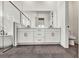 Elegant bathroom featuring double vanity and dark-flooring at 17931 Palmiste Dr, Bradenton, FL 34202