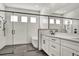 Modern bathroom with double vanity, soaking tub, and walk-in shower at 17931 Palmiste Dr, Bradenton, FL 34202