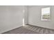 Spacious bedroom featuring carpet and a window view at 17931 Palmiste Dr, Bradenton, FL 34202