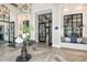 Clubhouse entryway with tiled flooring, decorative table, and seating area at 17931 Palmiste Dr, Bradenton, FL 34202