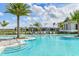 Resort-style community pool with cabanas and lounge chairs at 17931 Palmiste Dr, Bradenton, FL 34202