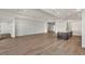 Open living room with hardwood floors and access to patio at 17931 Palmiste Dr, Bradenton, FL 34202