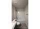 Bright bathroom featuring a shower-tub combination with white tiling and modern fixtures, complemented by neutral-toned flooring at 3884 S Haberland Blvd, North Port, FL 34288