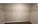 Walk-in closet with carpeted flooring and wire shelving for organized storage at 3884 S Haberland Blvd, North Port, FL 34288