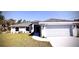 Beautiful one-story home showcasing a well-manicured lawn, a two-car garage, and a welcoming walkway to the front door at 3884 S Haberland Blvd, North Port, FL 34288