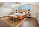 Relaxing bedroom with a wicker bed, and plenty of natural light at 5727 Riegels Point Rd, Sarasota, FL 34242