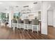 Modern kitchen with white cabinets, stainless steel appliances, and an island at 5727 Riegels Point Rd, Sarasota, FL 34242