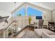 Bright home office loft area with water views and built-in desk at 5727 Riegels Point Rd, Sarasota, FL 34242
