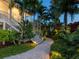 Modern outdoor staircase with landscape lighting at night at 5727 Riegels Point Rd, Sarasota, FL 34242