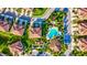 Aerial view of community showing pool, landscaping, and building rooftops at 8214 Las Lilias Ct, Sarasota, FL 34243