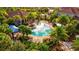 Community pool area with lounge chairs and landscaping at 8214 Las Lilias Ct, Sarasota, FL 34243