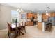 Casual dining area adjacent to kitchen with wooden table and chairs at 8214 Las Lilias Ct, Sarasota, FL 34243