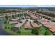 Wide aerial view of the neighborhood and surrounding landscape at 8214 Las Lilias Ct, Sarasota, FL 34243