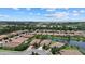 Aerial view showcasing the community and lake at 8214 Las Lilias Ct, Sarasota, FL 34243