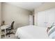 Bedroom with a queen bed, built-in shelves, and an ensuite bathroom at 8214 Las Lilias Ct, Sarasota, FL 34243