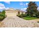 One-story house with a brick driveway and red door at 8214 Las Lilias Ct, Sarasota, FL 34243