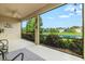 Relaxing screened lanai overlooking a pond with views of the community at 8214 Las Lilias Ct, Sarasota, FL 34243