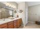 Double vanity bathroom with a large mirror and separate shower at 8214 Las Lilias Ct, Sarasota, FL 34243