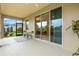 Relaxing screened porch with access to the backyard at 8214 Las Lilias Ct, Sarasota, FL 34243