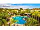 Resort-style pool with surrounding lounge and community buildings at 8214 Las Lilias Ct, Sarasota, FL 34243