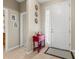 Inviting entryway with red accent table and neutral walls at 8214 Las Lilias Ct, Sarasota, FL 34243