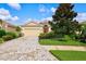 One-story house with a brick driveway and red door at 8214 Las Lilias Ct, Sarasota, FL 34243