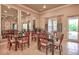Community dining room with multiple tables and access to the outdoors at 8214 Las Lilias Ct, Sarasota, FL 34243
