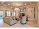 Elegant clubhouse living room with large TV and comfortable seating at 8214 Las Lilias Ct, Sarasota, FL 34243