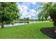 Beautiful backyard with pond and conservation views at 8214 Las Lilias Ct, Sarasota, FL 34243