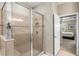 Large walk-in shower with neutral tile and glass enclosure at 8214 Las Lilias Ct, Sarasota, FL 34243