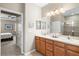 Double vanity bathroom with access to main bedroom and shower at 8214 Las Lilias Ct, Sarasota, FL 34243