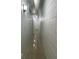 Long hallway with light-colored walls and terrazzo flooring at 1928 9Th St, Sarasota, FL 34236